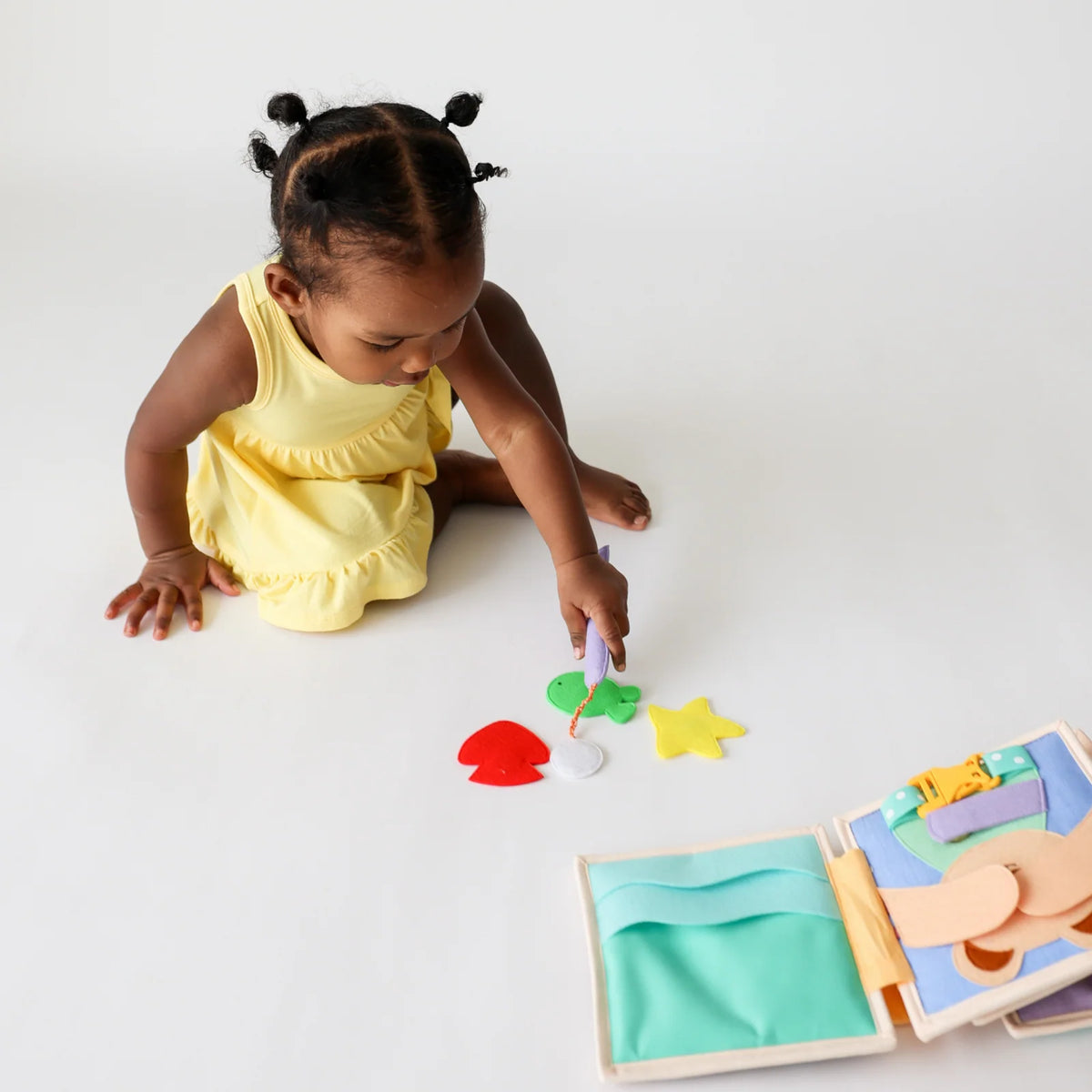 Mini Busy Book for Practical Skills and Imaginative Play with Three Dinosaur Finger Puppets