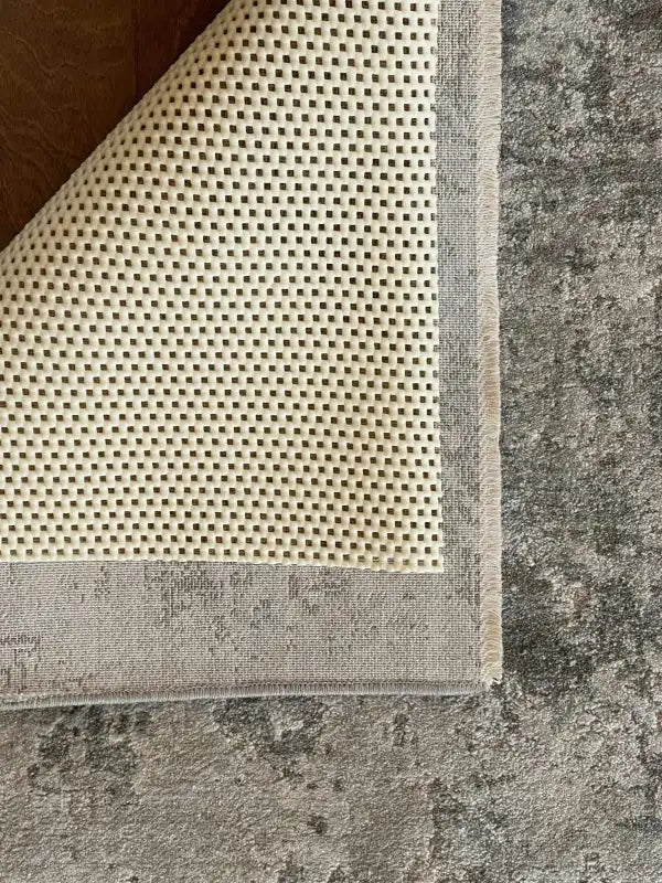 Non-Slip Rug Pad in Cream PVC, 0.16-Inch Thick and Easy to Trim