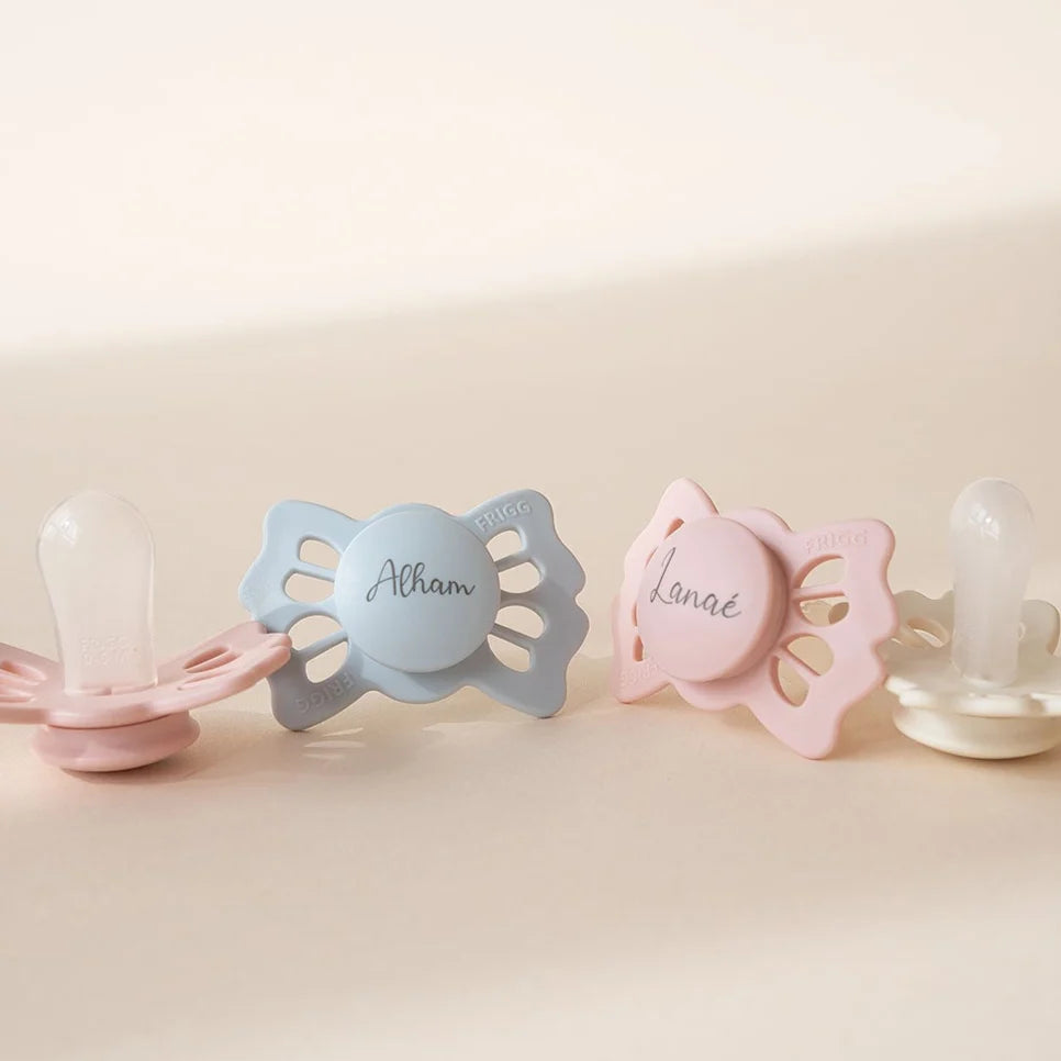 Personalized Silicone Pacifier with a Symmetrical Teardrop Nipple and Four-Leaf Clover Inspired Design