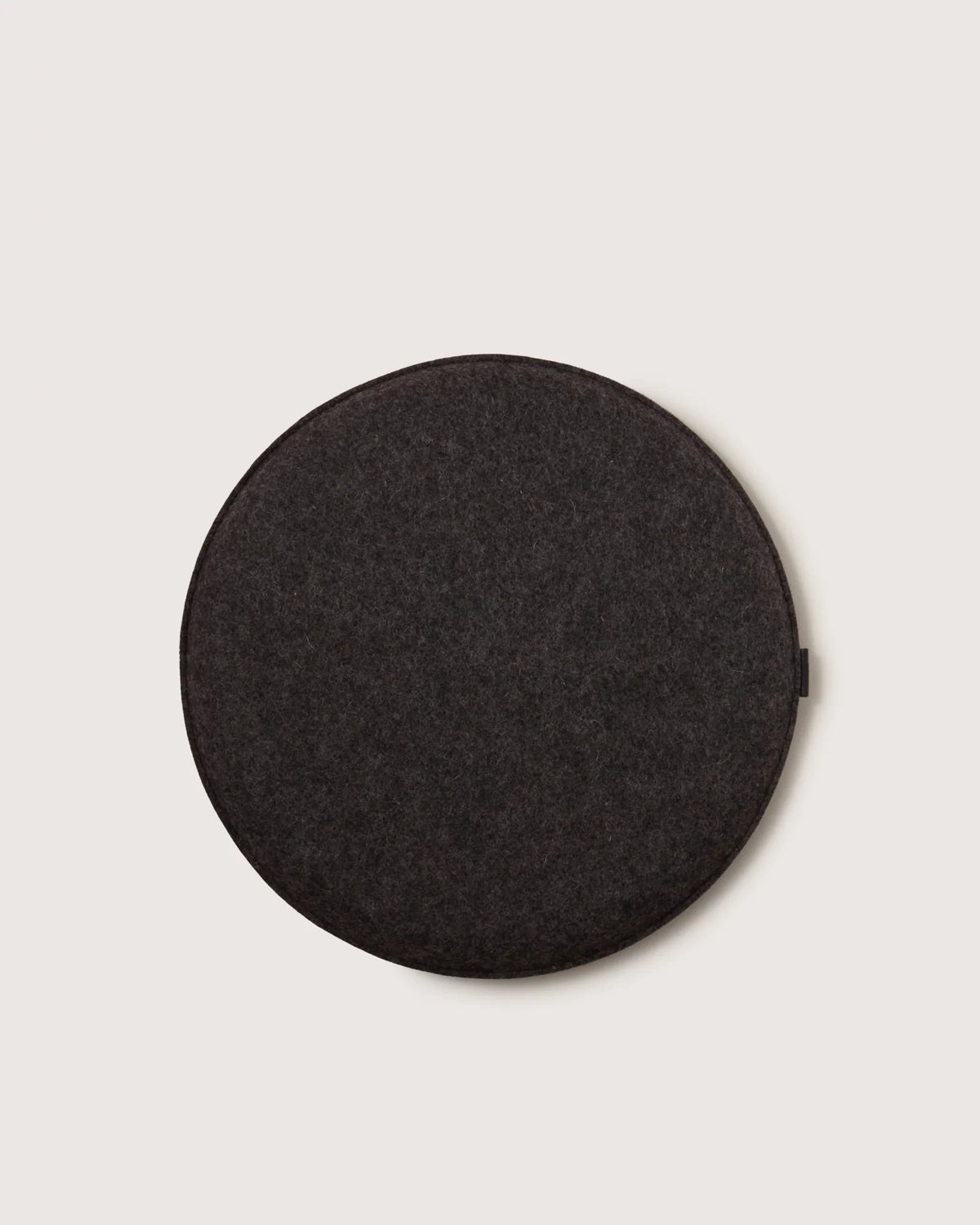 Round Merino Wool Seat Cushion in Charcoal