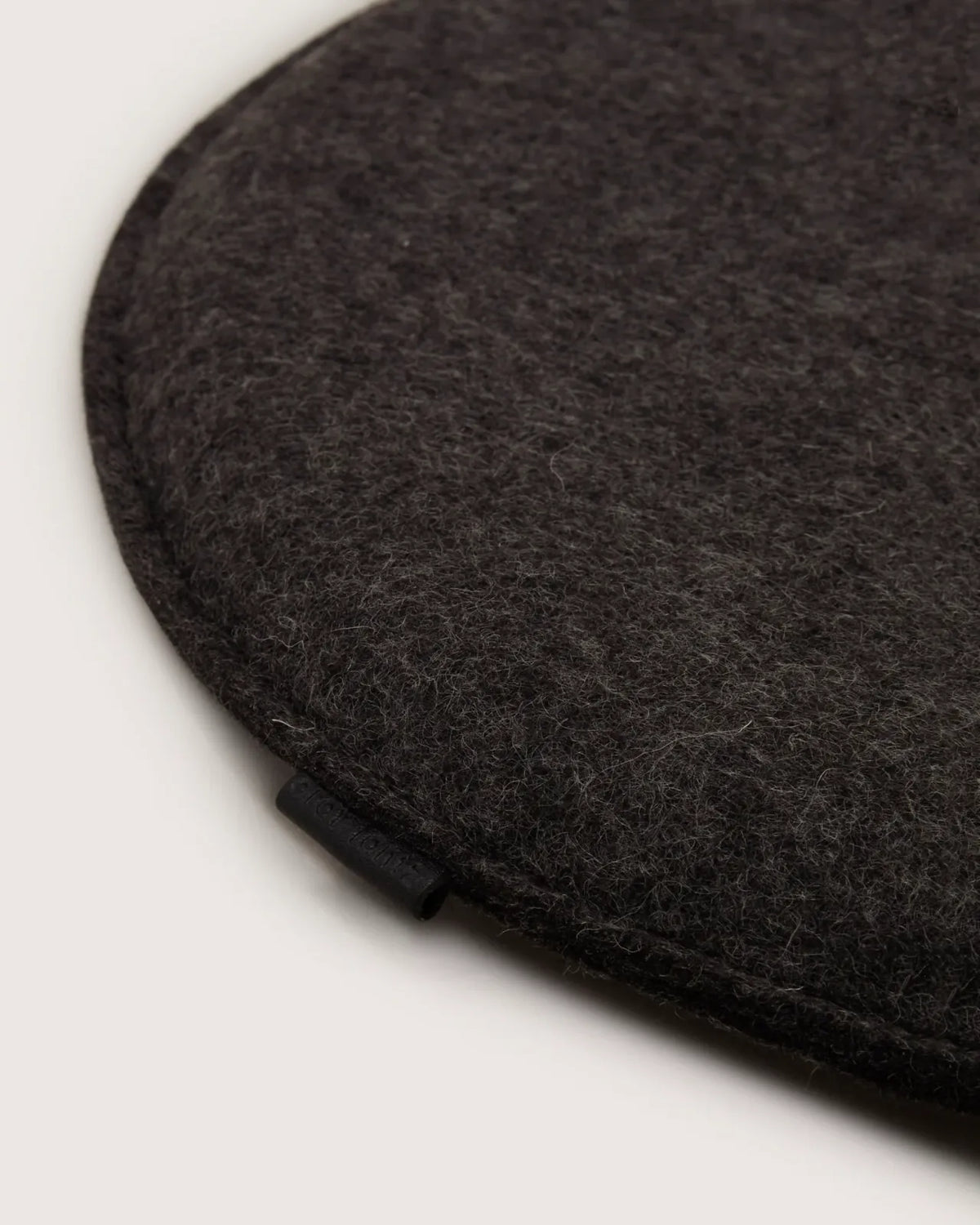 Round Merino Wool Seat Cushion in Charcoal