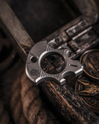 Titanium Bottle Opener Tool with Stonewashed or Elden Edition Finish and Tritium Slots · Machined Grade 5 titanium plate c