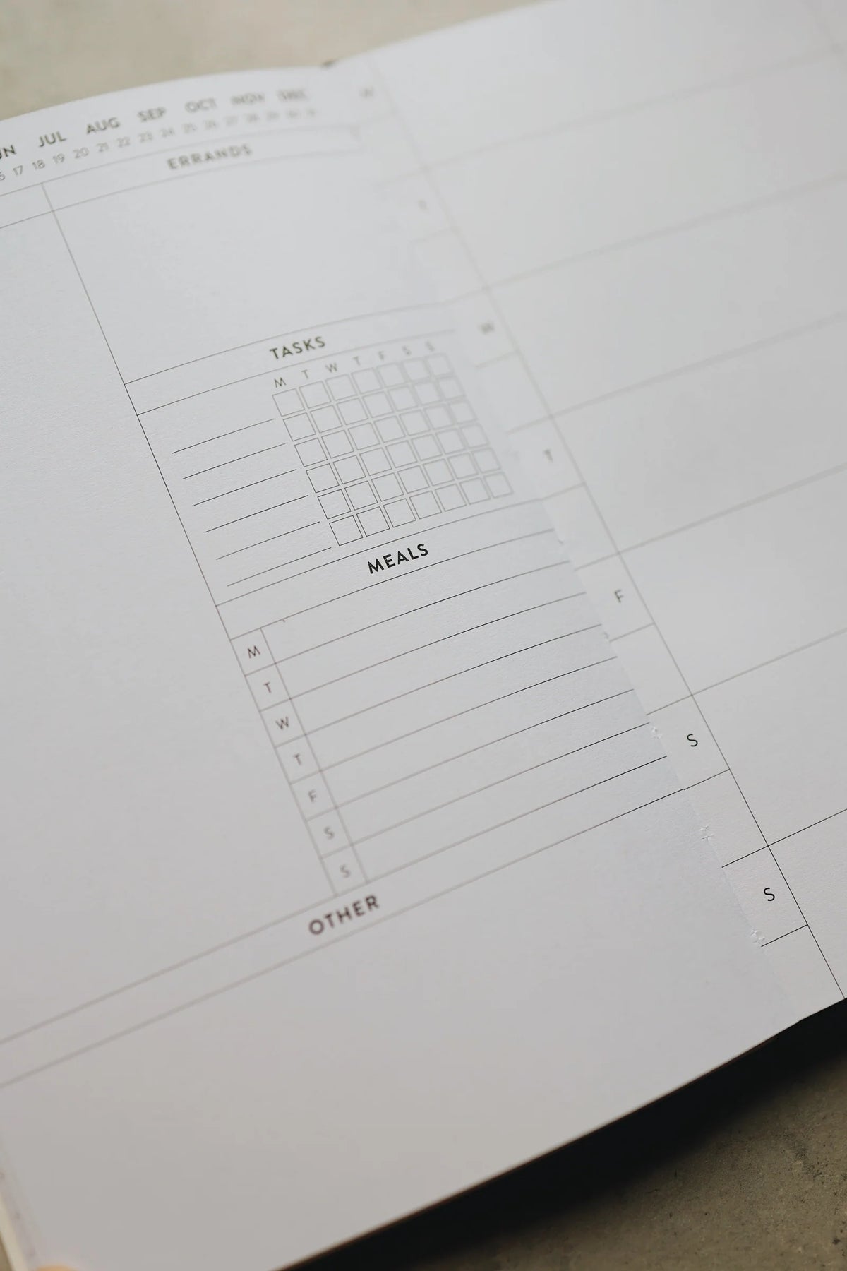 Undated Weekly Planner with a Wipeable Checkers Cover and Equal Space for Weekdays and Weekends
