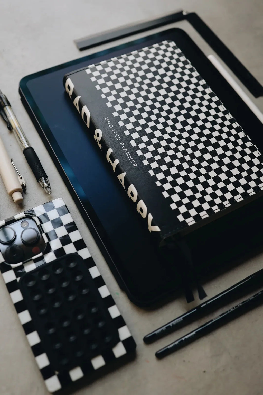 Undated Weekly Planner with a Wipeable Checkers Cover and Equal Space for Weekdays and Weekends