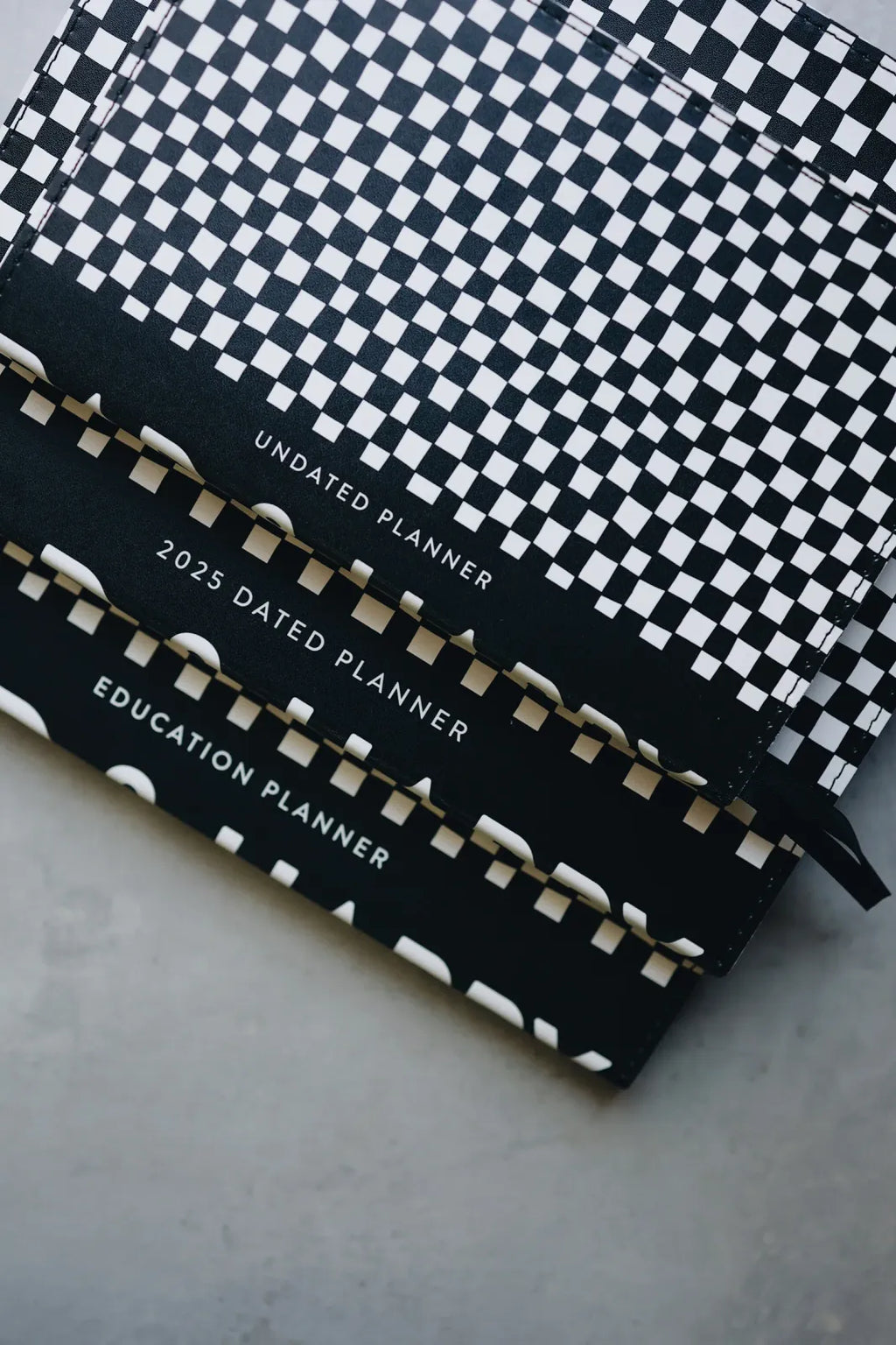 Undated Weekly Planner with a Wipeable Checkers Cover and Equal Space for Weekdays and Weekends