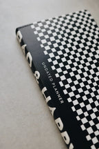 Undated Weekly Planner with a Wipeable Checkers Cover and Equal Space for Weekdays and Weekends