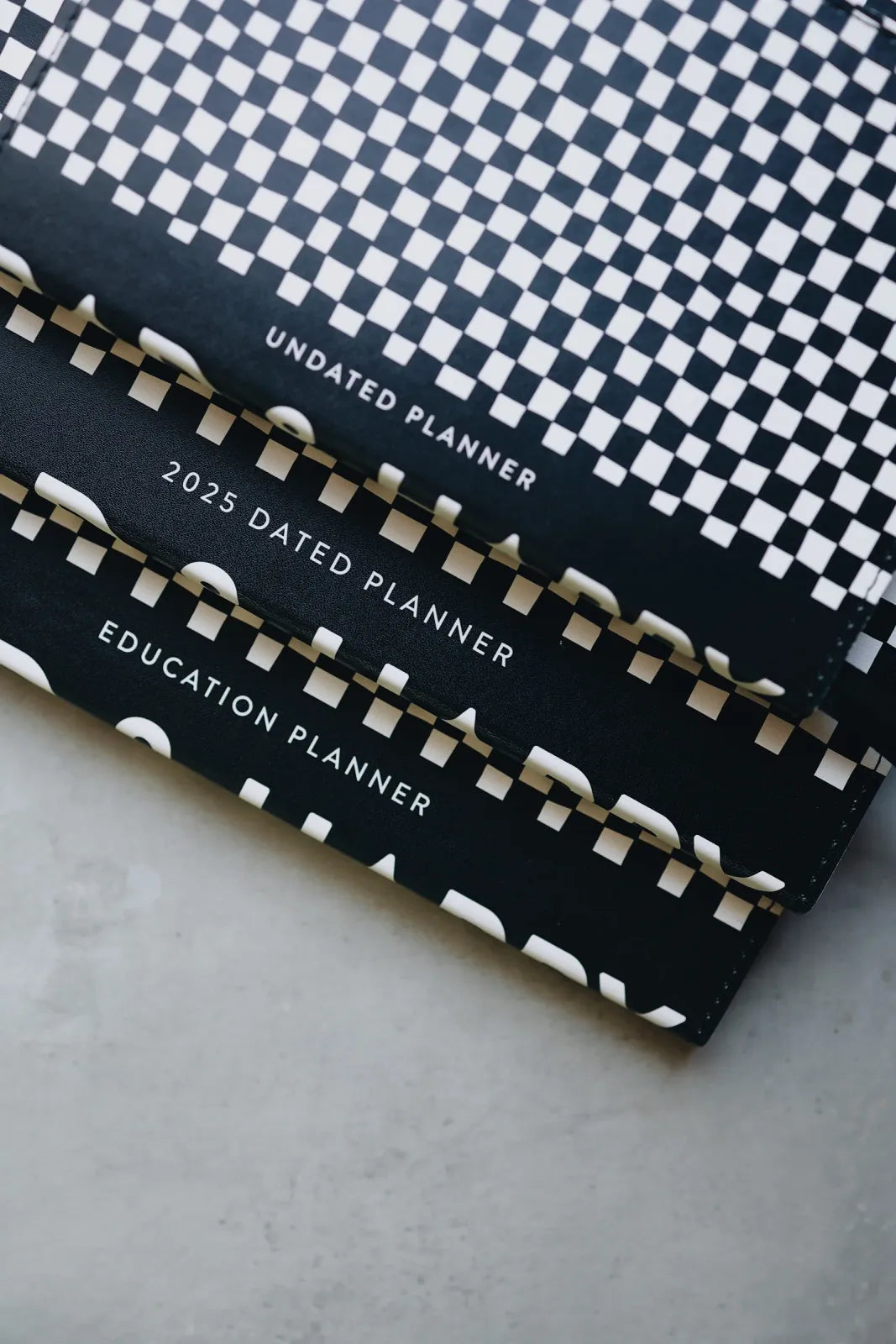 Undated Weekly Planner with a Wipeable Checkers Cover and Equal Space for Weekdays and Weekends