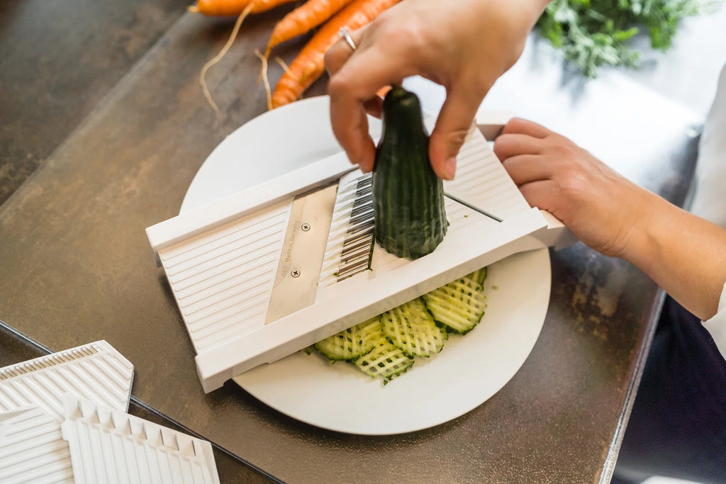Universal Mandoline Slicer with Interchangeable Cutting Elements, Food Holder and Finger Protection