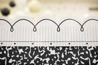 White Bulletin Board Border with Black Looping Bows, 21 Gloss-Finish Strips for Classroom Displays
