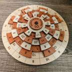 Wooden Math Puzzle in Cherry and Maple Hardwood, Featuring Five Rotating Rings and a Single Solution